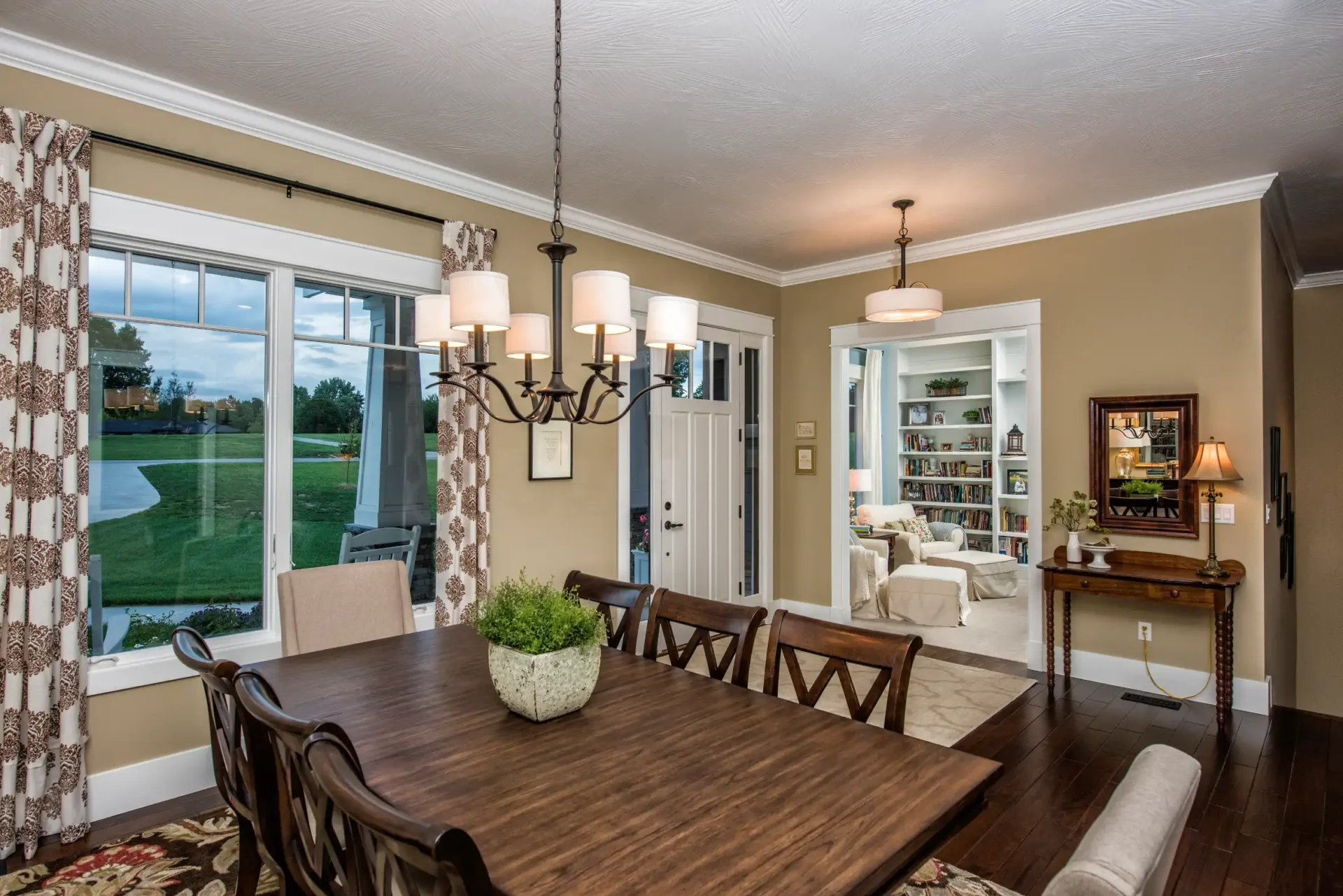 doorway with dining room and large windows with curtains 2