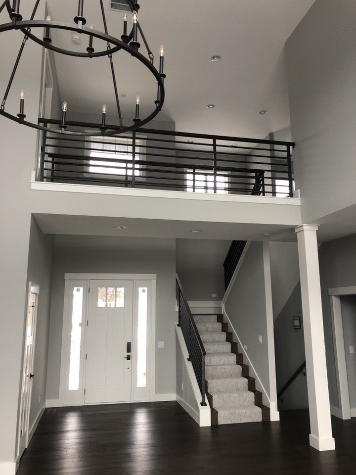 Entryway black and white motif with chandelier