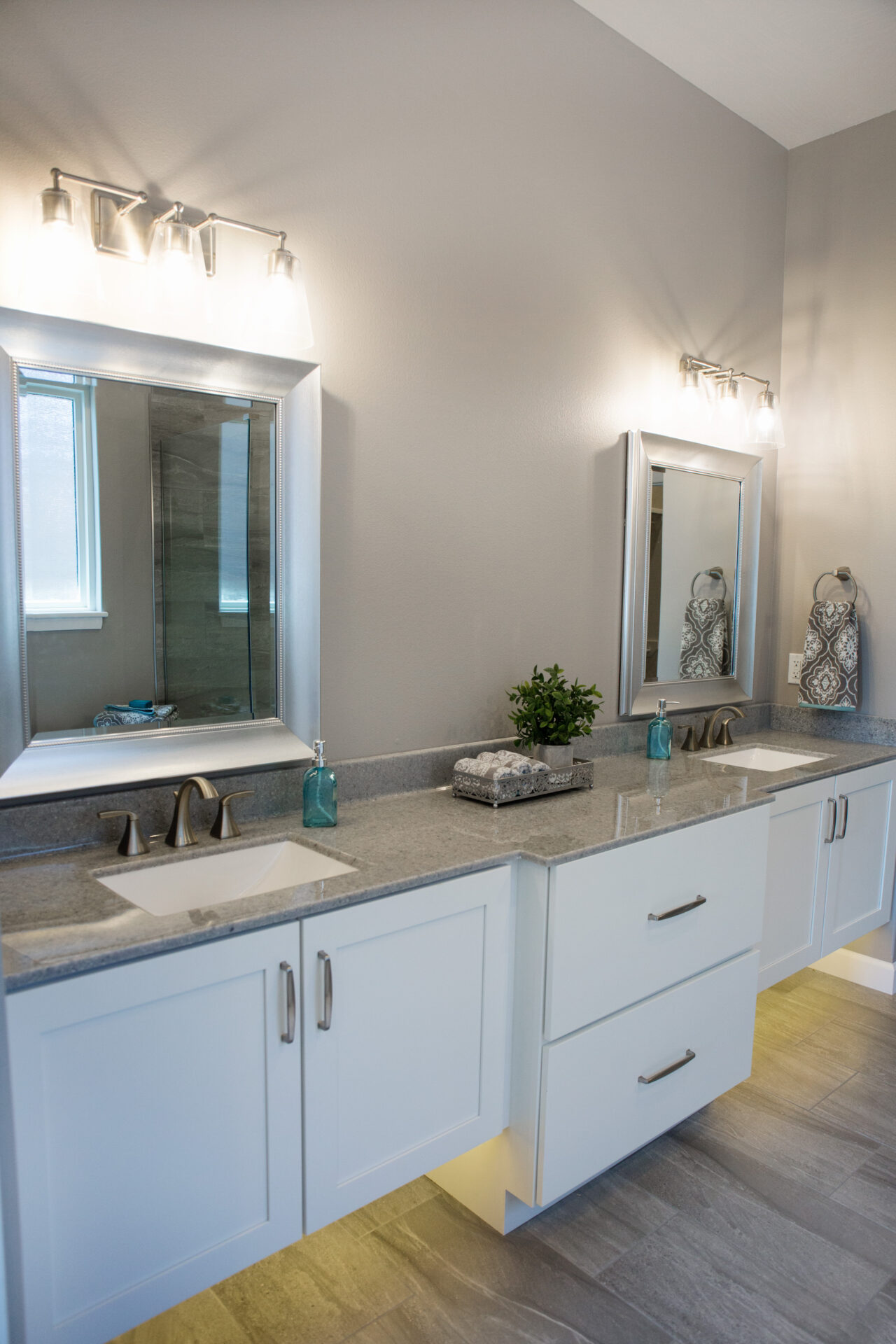 Ruskin17-13 scaled bathroom with white cabinets and mirrors