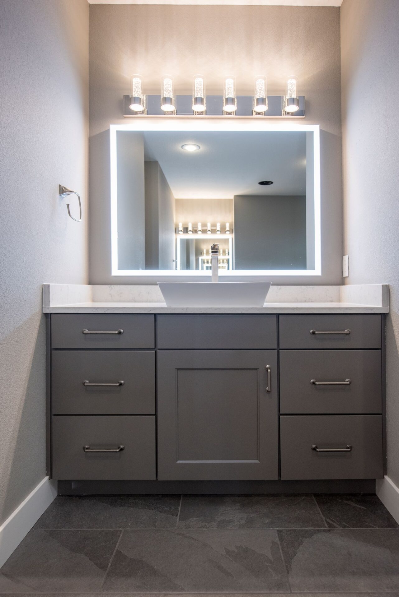 bathroom mirror with lights and white sink 