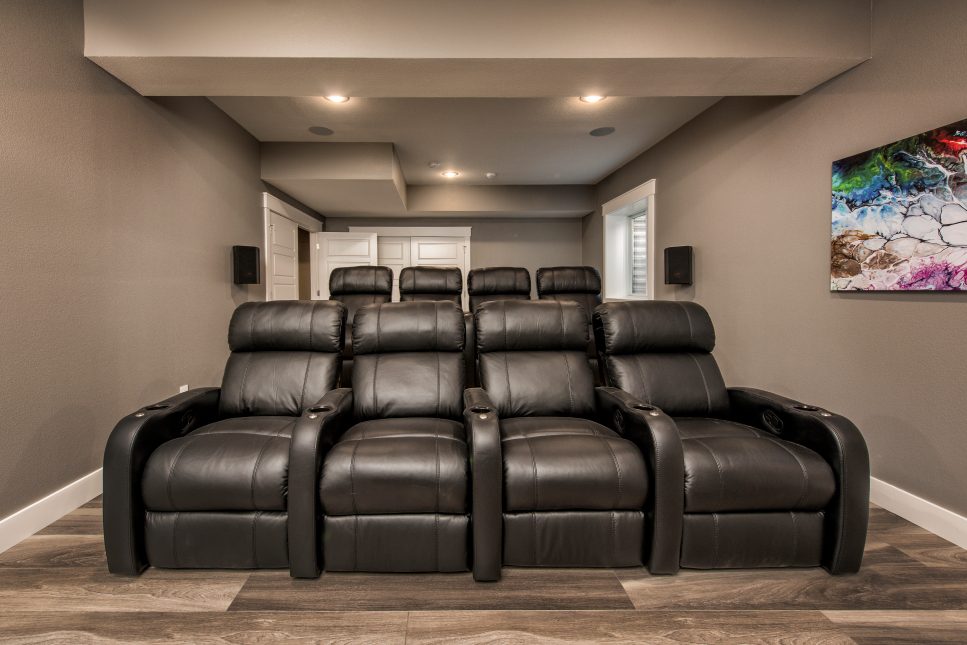 small theater with black leather chairs