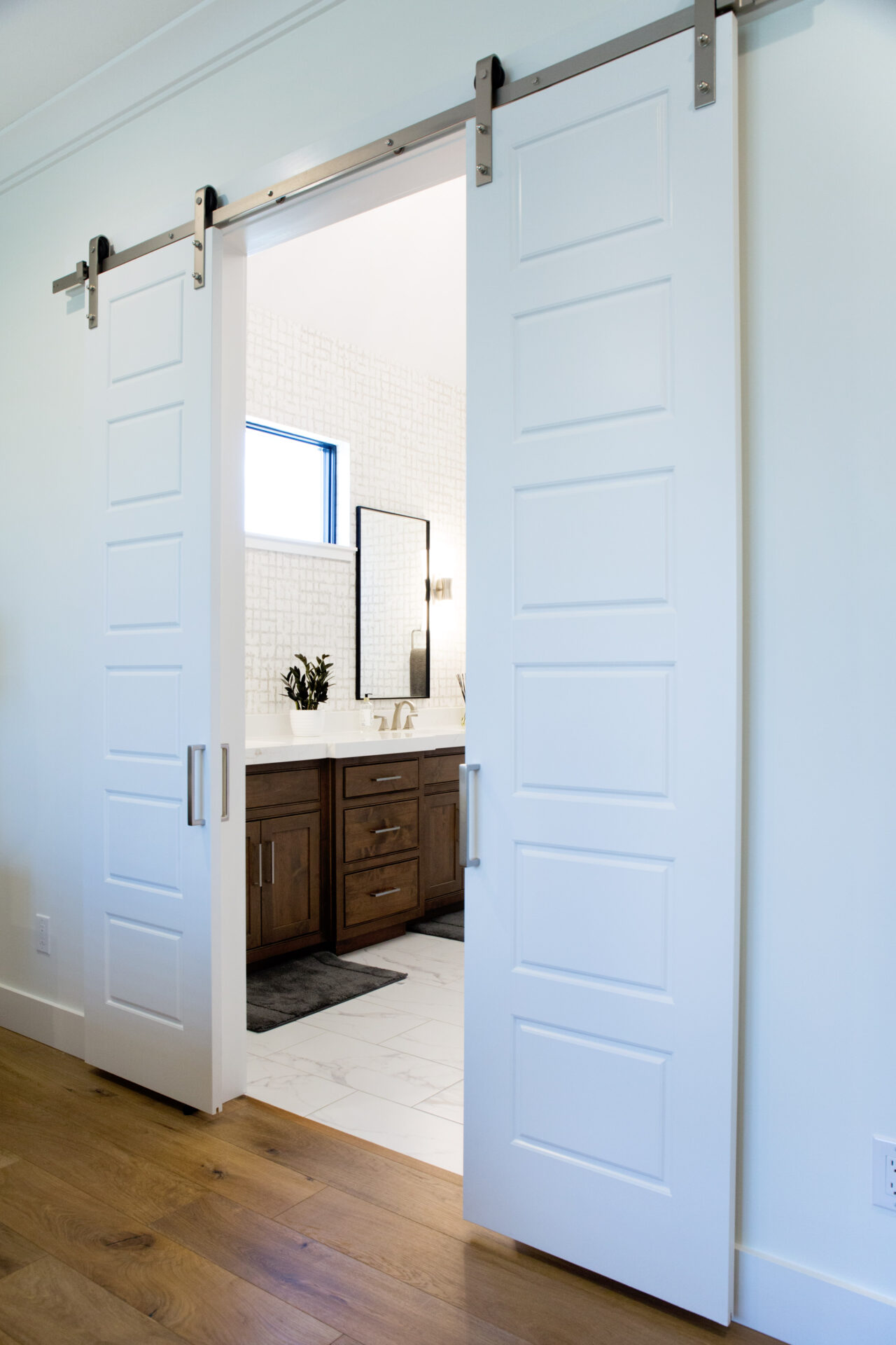 A bathroom with two sliding doors