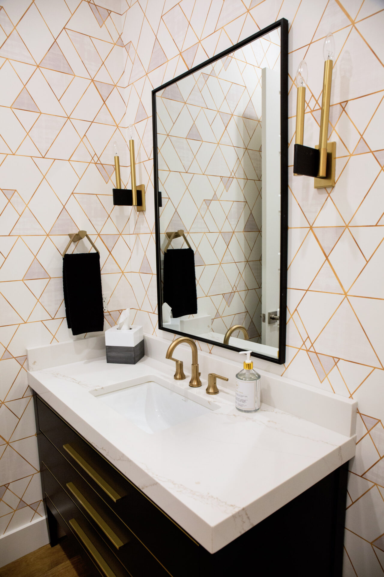 A clean bathroom sink and mirror