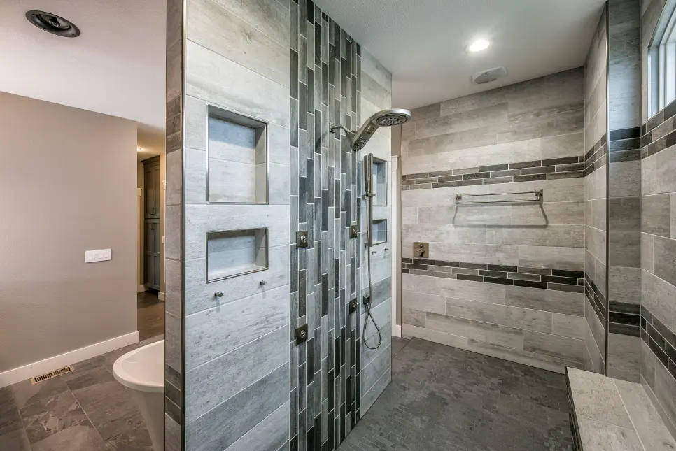 shower and bathtub with rectangle stone tiles